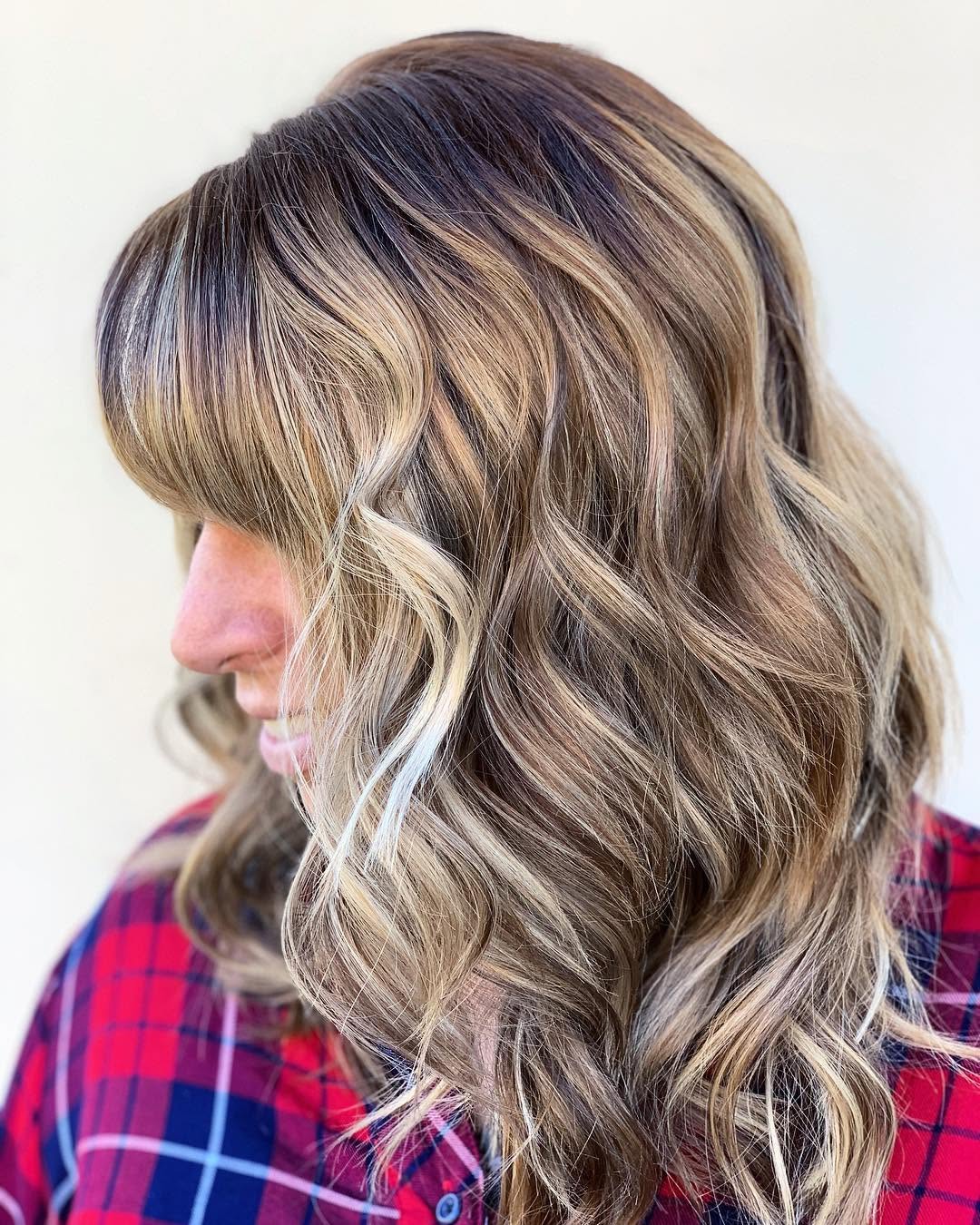 Anyone else ready to start going  lighter for Spring 2019? 🙋🏻‍♀️ We brought this balayage closer to the root, while also glazing the hair to cancel out the residual warmth. Remember ladies, lightening takes time...😉